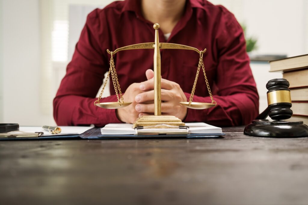 A male lawyer is working at his desk on online judicial review,focusing on justice,fairness,legal